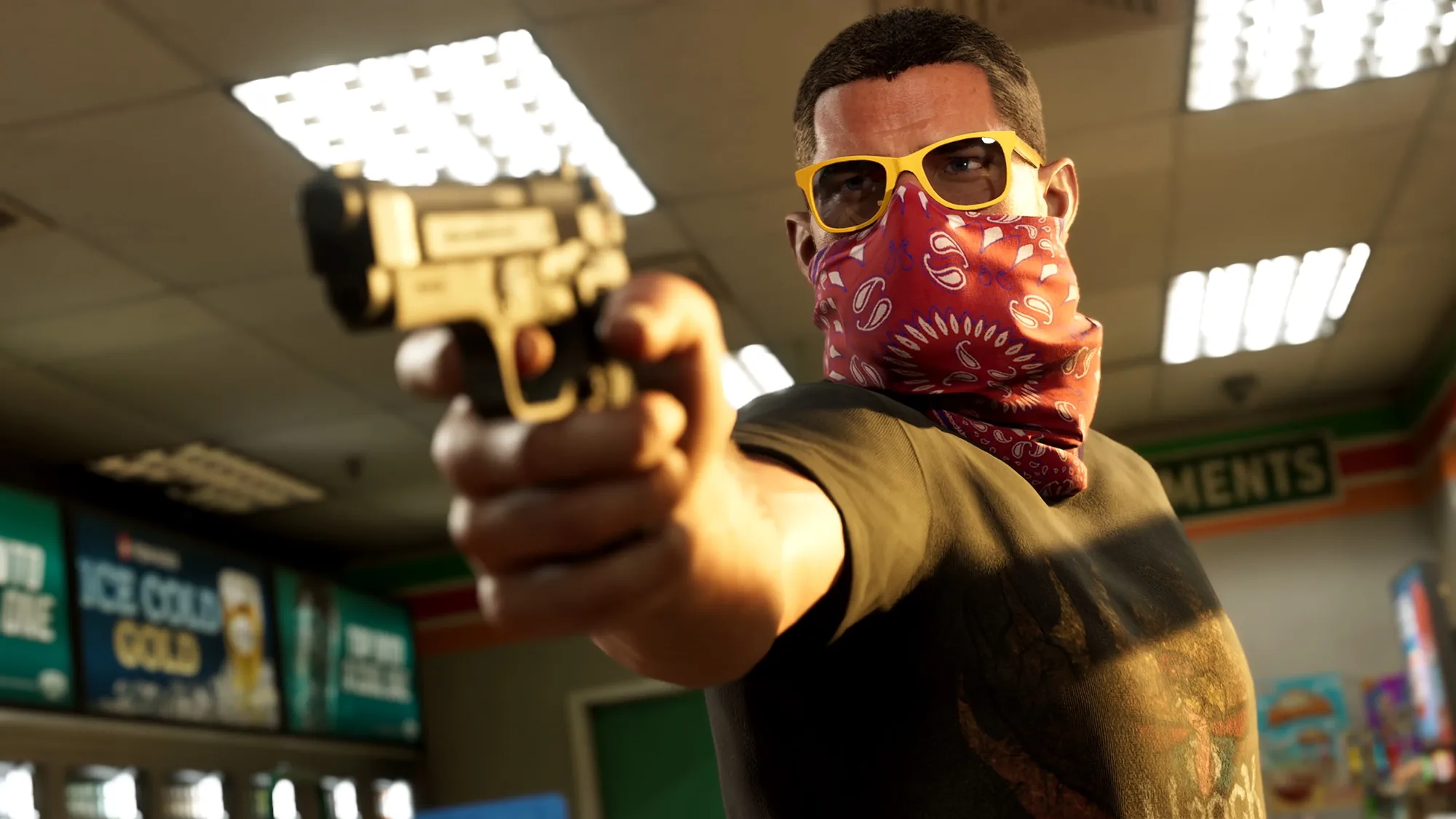 A man in yellow sunglasses and a red patterned bandana points a gold revolver toward the camera inside a brightly lit gym or sports facility.